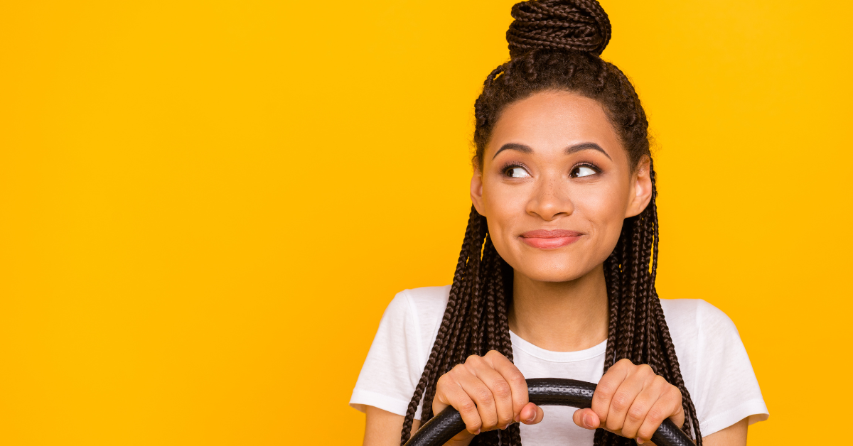 woman with hands on wheel