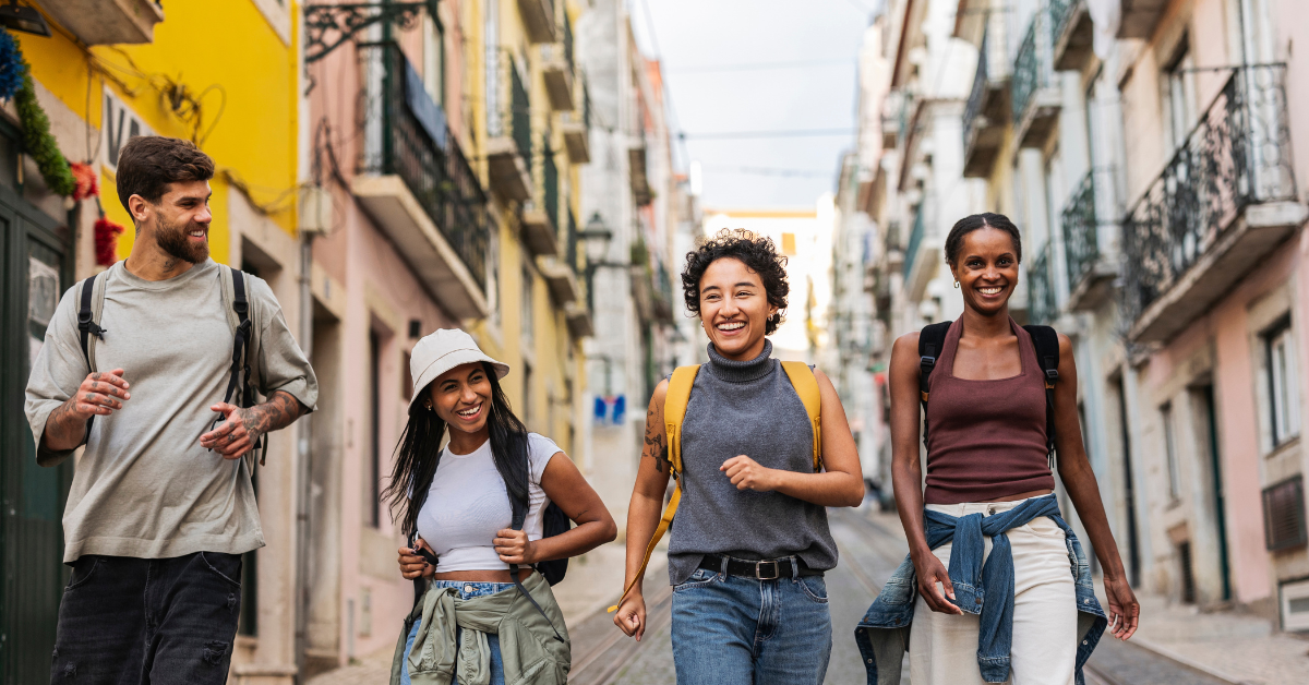 four people smiling