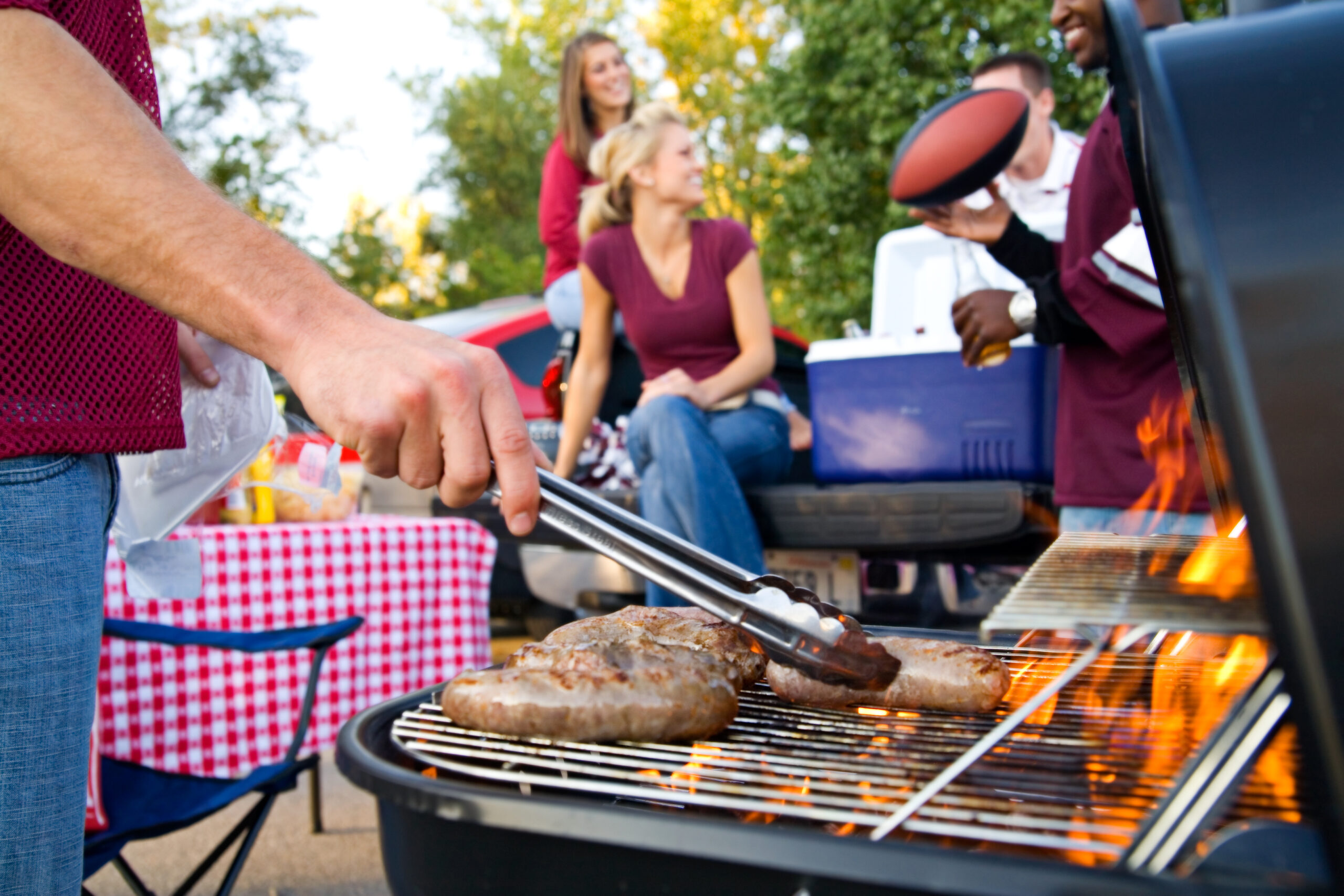 man grilling meat
