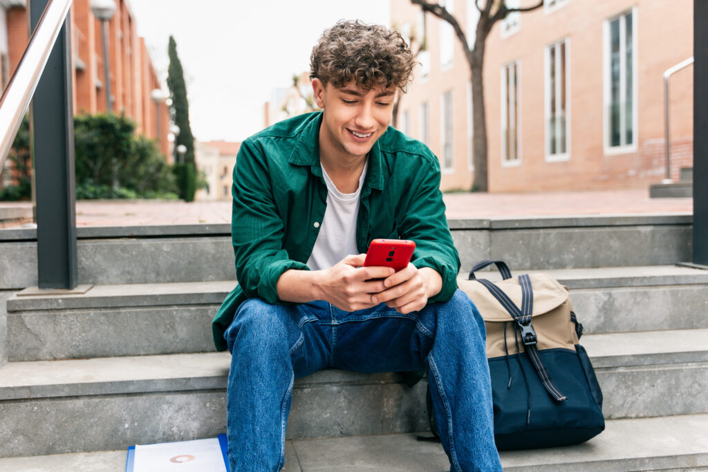 student with a phone