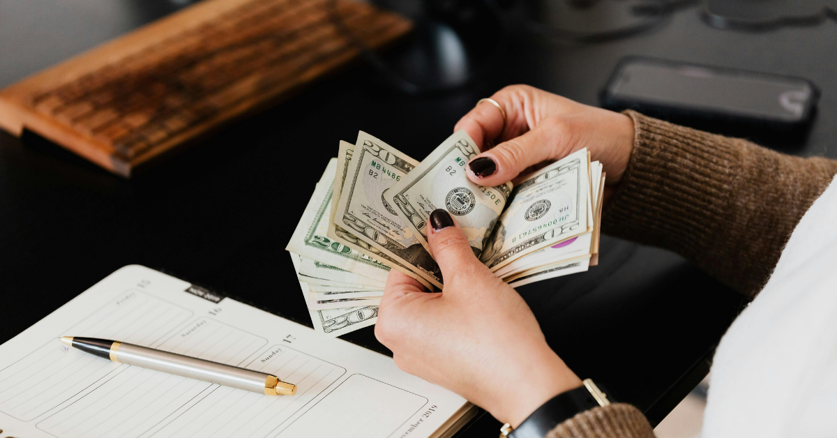 hands holding money