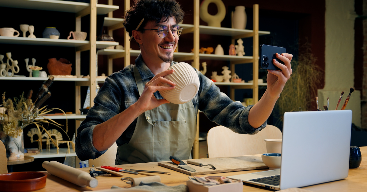man holding a bowl and a cellphone